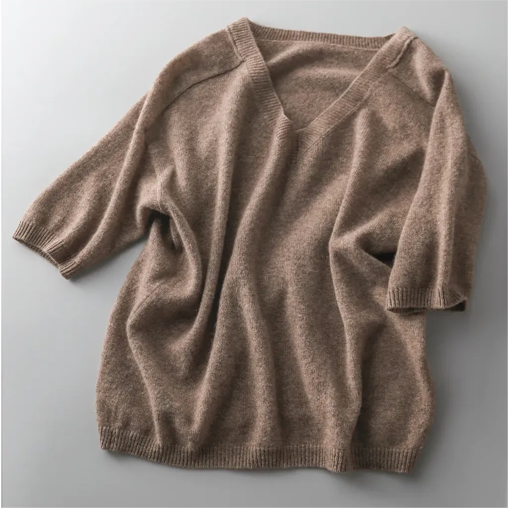 Brown sweater on a light gray background