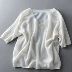 White sweater on a gray background