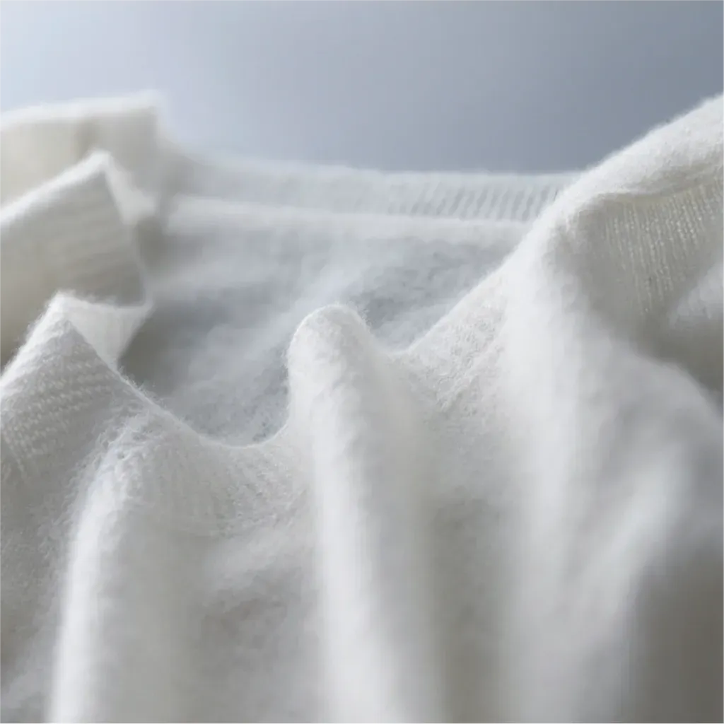 Close-up of white fabric texture on a light gray background