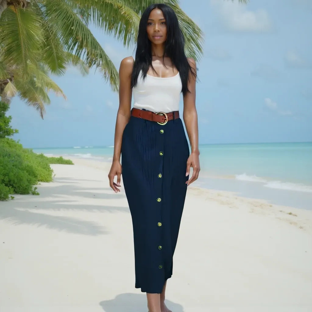 Woman standing on a tropical beach with palm trees and clear blue sky.