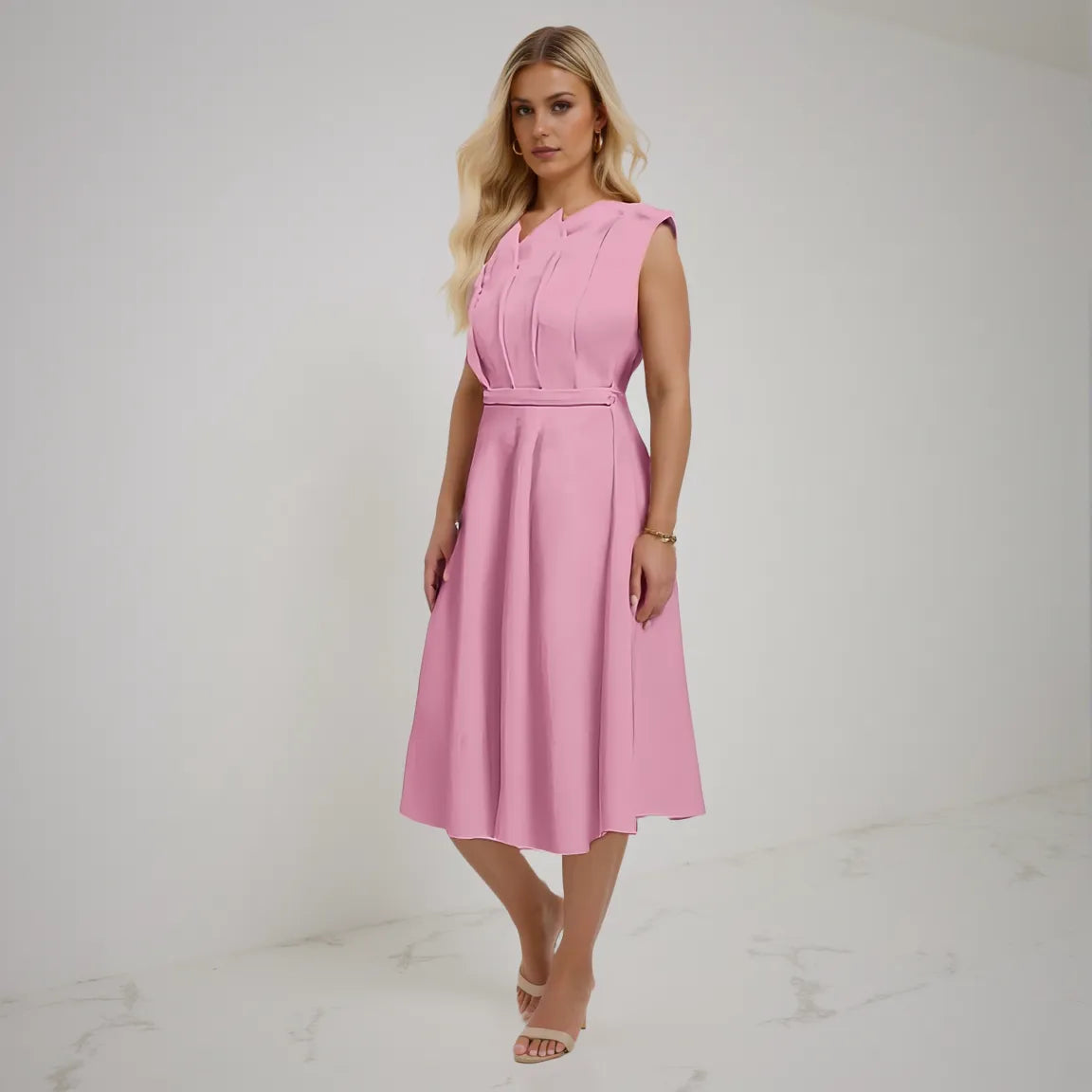 Woman wearing a pink dress on a white background