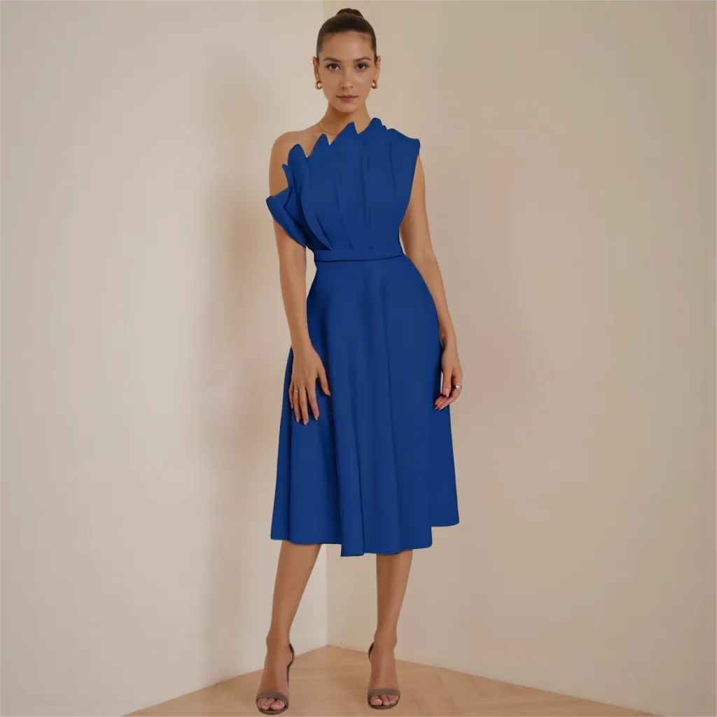 Woman wearing a blue dress against a beige background