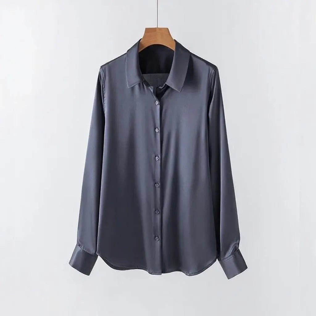 Gray shirt on a wooden hanger against a white background