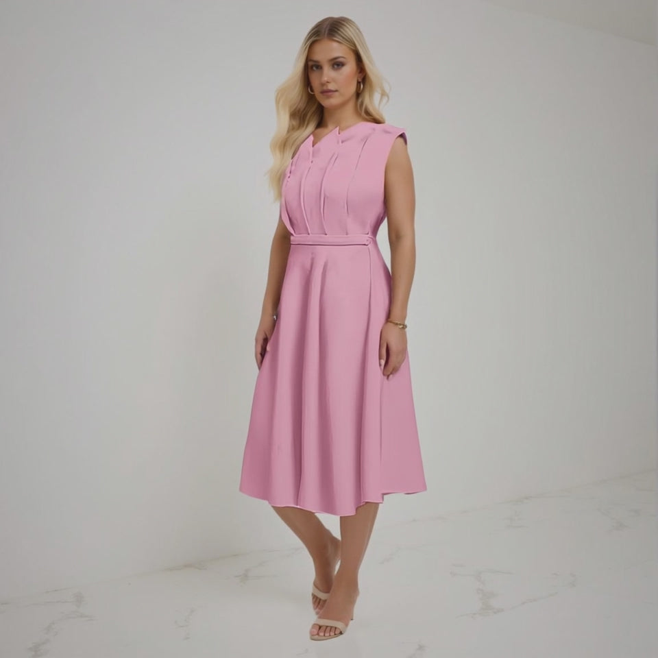 Woman wearing a pink dress on a white background