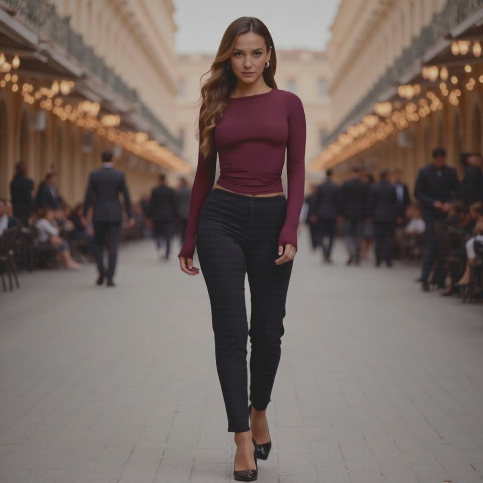 Woman walking down a street in an urban setting with blurred background