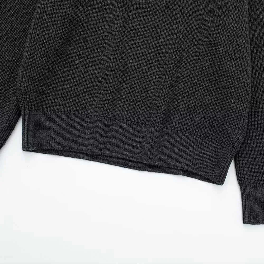 Dark gray ribbed knit sweater on a white background