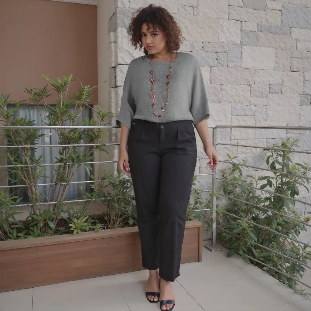 Woman standing on a balcony with plants and a stone wall background